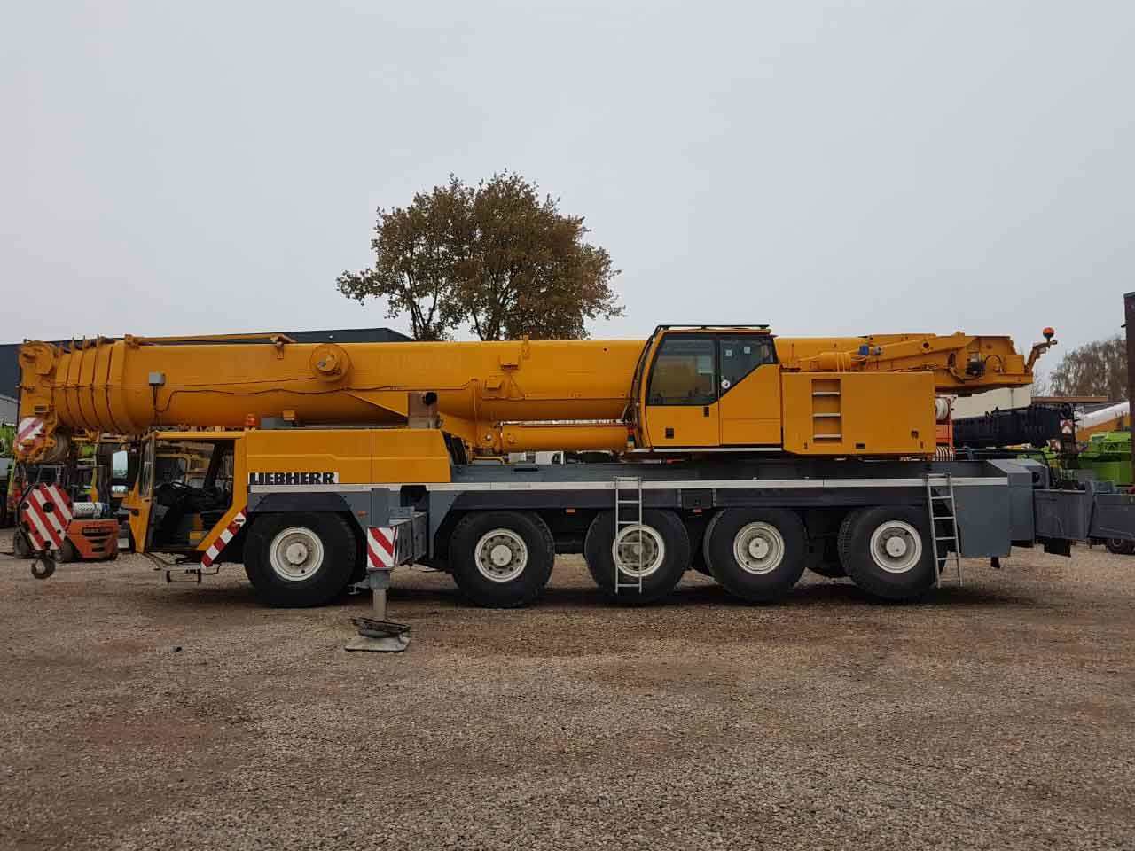 Liebherr LTM all-terrain mobile crane parked in an industrial yard